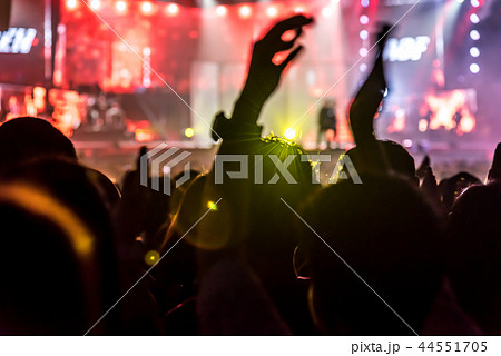 Crowd of hands up concert stage lights enjoying co 44551705