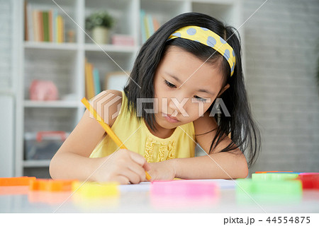 Girl drawing with pencil Girl drawing with pencil 44554875
