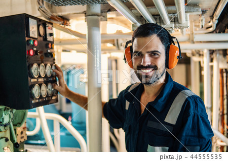 Marine engineer officer working in engine room Marine engineer officer working in engine room 44555535