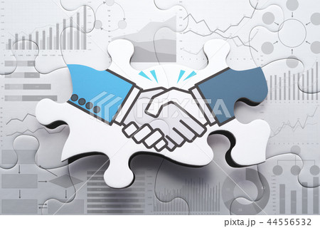 合意形成や戦略的パートナーシップのイメージ。握手するイラストが描かれたジグソーパズル。 合意形成や戦略的パートナーシップのイメージ。握手するイラストが描かれたジグソーパズル。 44556532