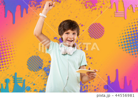 Joyful gay boy getting victory in game 44556981
