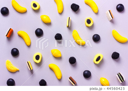 Variety of candy pattern on pastel background. 44560423