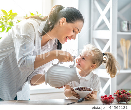 Happy family having breakfast. 44562121
