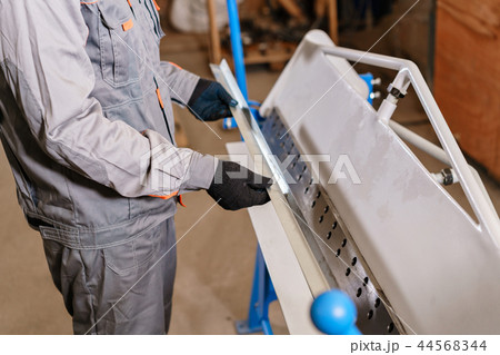 closeup of the metal corner of zinced. Tool and bending equipment for sheet metal. manufacture 44568344