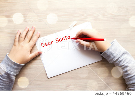Child's hands writting letter to Santa. Child's hands writting letter to Santa. 44569460