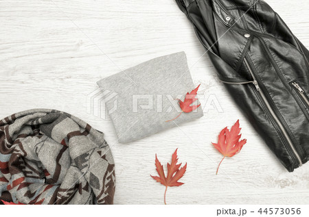 Gray sweater with space for text, a black jacket Gray sweater with space for text, a black jacket 44573056