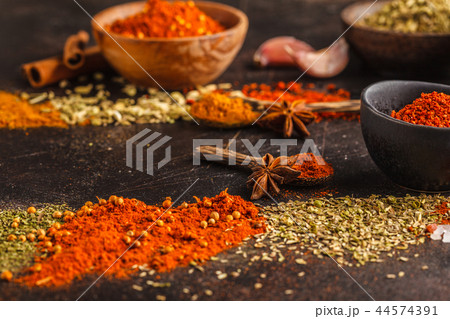 Different kind of spices on dark background. Different kind of spices on dark background. 44574391