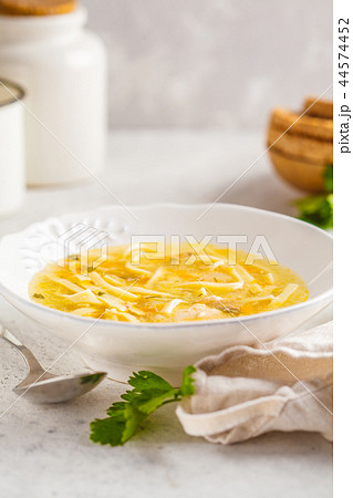 Homemade chicken noodle soup in a white plate Homemade chicken noodle soup in a white plate 44574452