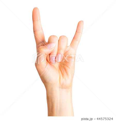Female hand showing rock n roll sign or giving the devil horns gesture Female hand showing rock n roll sign or giving the devil horns gesture 44575324