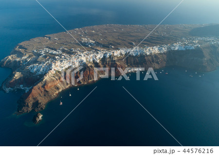 Aerial view flying over city of Oia on Santorini Greece Aerial view flying over city of Oia on Santorini Greece 44576216