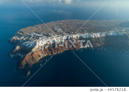 Aerial view flying over city of Oia on Santorini Greece Aerial view flying over city of Oia on Santorini Greece 44576218