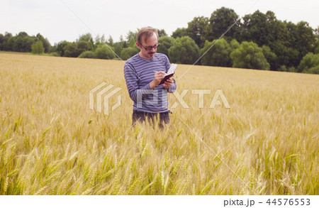 The man ecologist making notes in the diary 44576553