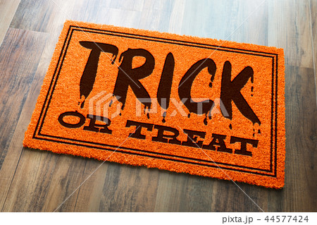 Trick Or Treat Halloween Welcome Mat On Wood   44577424