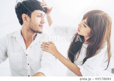 Happy young couple relaxing in the home bedroom. 44578684