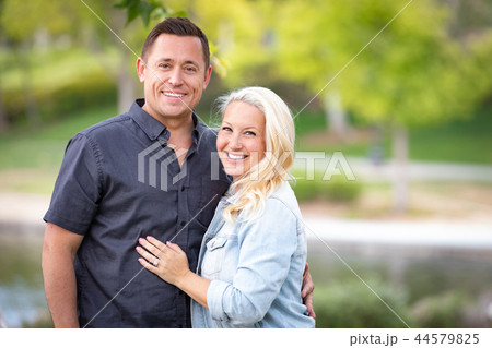 Young Caucasian Couple Portrait In The Park 44579825