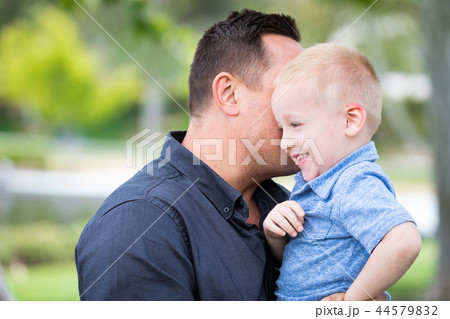 Young Boy Having Fun With His Father At The Park Young Boy Having Fun With His Father At The Park 44579832