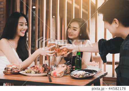 Teenager having enjoy drinking beer and clinking Teenager having enjoy drinking beer and clinking 44582176