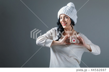 Young woman holding a gift box Young woman holding a gift box 44582697