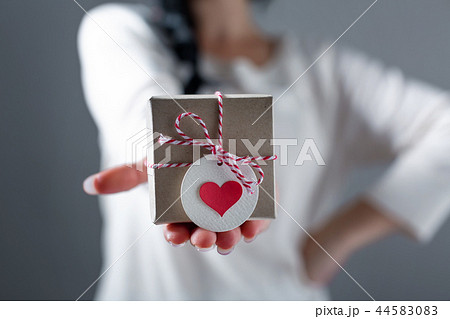 Woman with a gift box 44583083