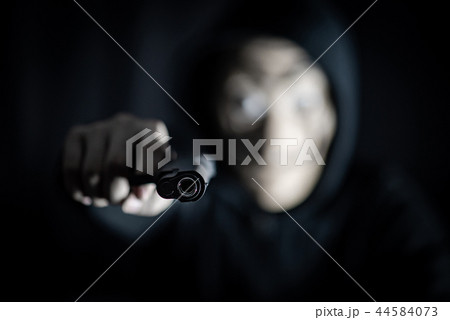 Hoodie killer man holding gun Hoodie killer man holding gun 44584073
