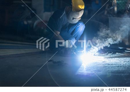 Welder Industrial automotive part in factory. 44587274