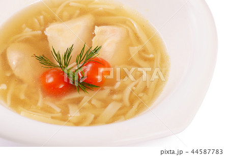 Soup homemade noodles with a chicken close up Soup homemade noodles with a chicken close up 44587783