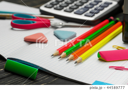 Bright items for a school on a wooden table 44589777