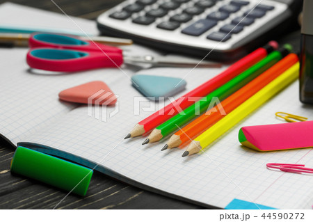 Bright items for a school on a wooden table Bright items for a school on a wooden table 44590272