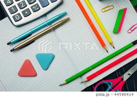 In the notebook are pens, pencils and calculator 44590414