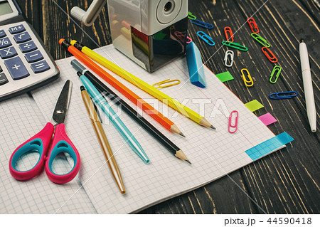 Bright items for a school on a wooden table 44590418
