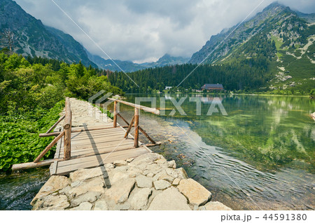 The lake is high in the mountains with a bridge. High Tatras, Slovakia 44591380