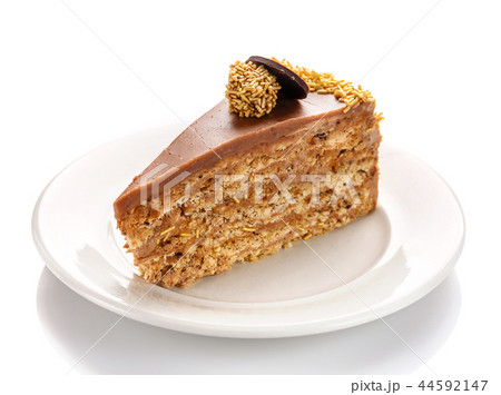 A piece of caramel cake, isolated on a white background 44592147
