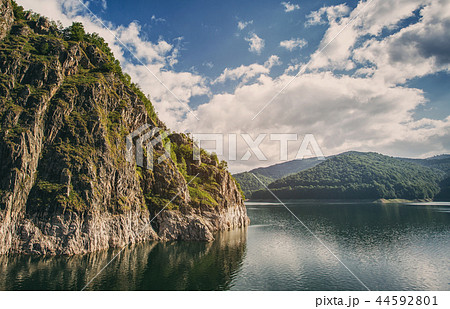 Mountain lake. Scenic landscape.. Beautiful blue sky with clouds 44592801