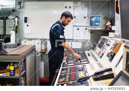 Marine engineer officer working in engine room Marine engineer officer working in engine room 44593691