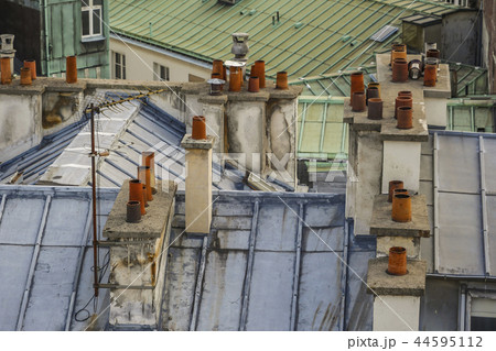 The roofs of Paris and its chimneys under a clouds sky The roofs of Paris and its chimneys under a clouds sky 44595112