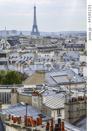 The roofs of Paris and its chimneys under a clouds sky The roofs of Paris and its chimneys under a clouds sky 44595155