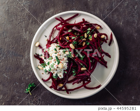 Raw beetroot noodles or beet spaghetti salad Raw beetroot noodles or beet spaghetti salad 44595281