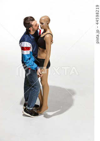 Fashion woman body. The man hugging mannequin, perfect woman dream concept 44598219