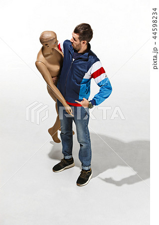 Fashion woman body. The man hugging mannequin, perfect woman dream concept 44598234