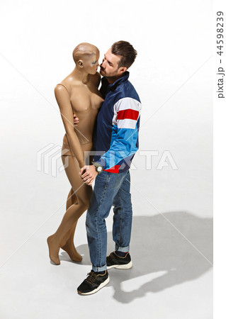 Fashion woman body. The man hugging mannequin, perfect woman dream concept 44598239