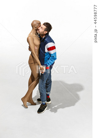 Fashion woman body. The man hugging mannequin, perfect woman dream concept Fashion woman body. The man hugging mannequin, perfect woman dream concept 44598777