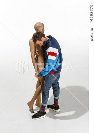Fashion woman body. The man hugging mannequin, perfect woman dream concept Fashion woman body. The man hugging mannequin, perfect woman dream concept 44598779