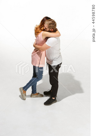 Full body portrait of hugging couple with smile. Caucasian models in love Full body portrait of hugging couple with smile. Caucasian models in love 44598780