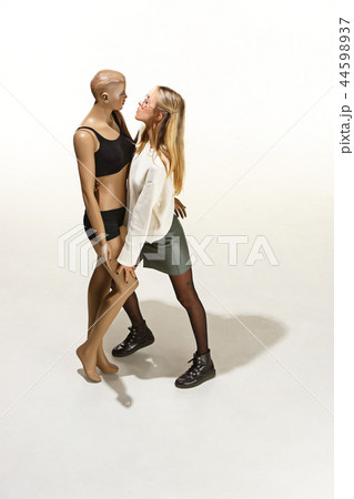Fashion woman body. The woman hugging mannequin, perfect woman dream concept Fashion woman body. The woman hugging mannequin, perfect woman dream concept 44598937