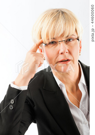 Thoughtful mature businesswoman with eyeglasses Thoughtful mature businesswoman with eyeglasses 44600060