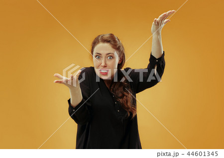 Beautiful female half-length portrait isolated on studio backgroud. The young emotional surprised 44601345