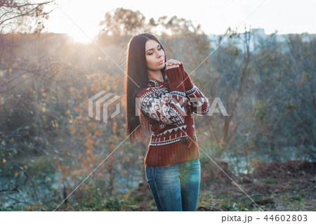 Pretty woman in the autumn before sunset. Pretty woman in the autumn before sunset. 44602803
