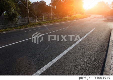 Asphalt road with marking lines white stripes Asphalt road with marking lines white stripes 44603515