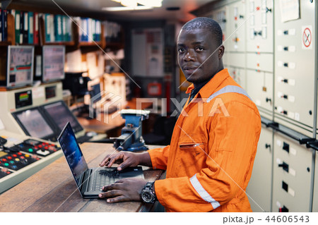 Marine engineer officer working in engine room Marine engineer officer working in engine room 44606543