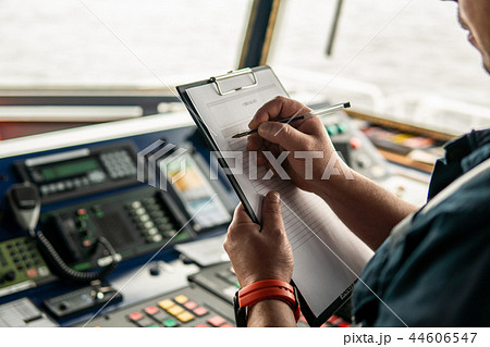 Marine navigational officer or chief mate on navigation watch Marine navigational officer or chief mate on navigation watch 44606547